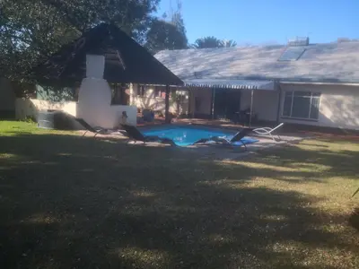 a house with a swimming pool in the yard at 15 On Reitz Bela bela in Bela-Bela
