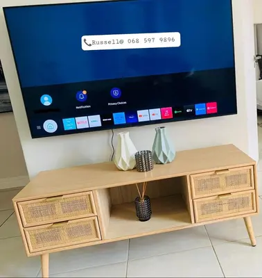 a tv sitting on top of a wooden tv stand at The Blyde -Ender137 in Pretoria