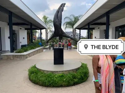 a statue of a whale in front of a building at The Blyde -Ender137 in Pretoria