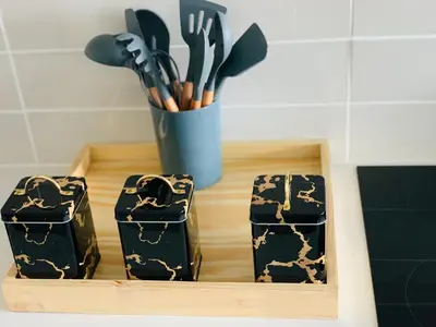 a wooden tray with a cup of utensils at The Blyde -Ender137 in Pretoria