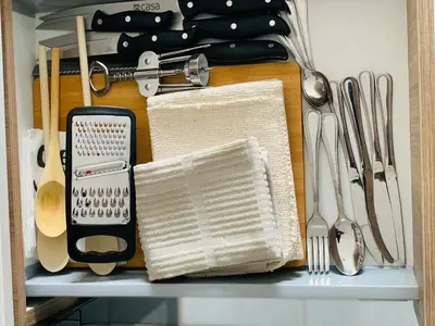 a drawer filled with kitchen utensils on a shelf at The Blyde -Ender137 in Pretoria