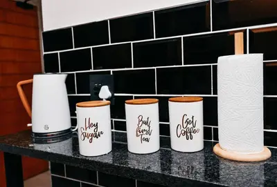 a group of four coffee cups sitting on a counter at Unit 508 at Menlyn Place in Pretoria