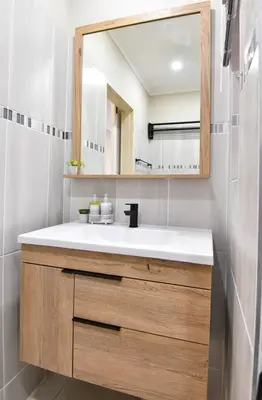 a bathroom with a sink and a mirror at Unit 508 at Menlyn Place in Pretoria