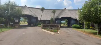 an entry to a house with a sign that reads guest house at Ebenhaeser overnight accomodation in Bela-Bela