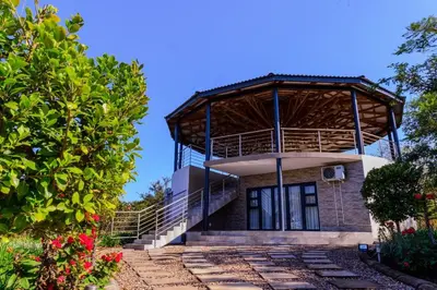 a house with a wooden roof at Nandoni Waterfront Resort in Thohoyandou
