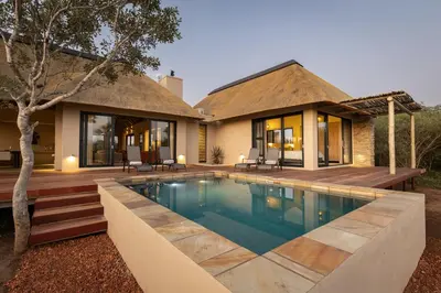 an image of a house with a swimming pool at Villa Tall Horse - Zandspruit Bush and Aero Estate in Hoedspruit