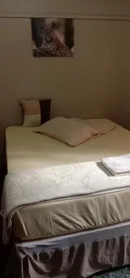 a bed in a bedroom with at Thully Teams in Nelspruit