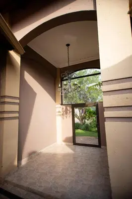 a hallway of a house with a chandelier at Pecanwood Lake View in Hartbeespoort