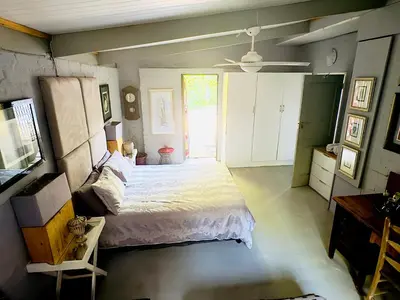 a bedroom with a large bed in a room at Soul Oasis Urban Retreat in Centurion