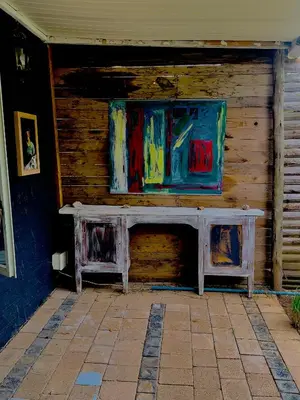 a wooden wall with a table in front of it at Soul Oasis Urban Retreat in Centurion