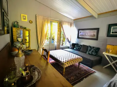 a living room with a couch and a table at Soul Oasis Urban Retreat in Centurion