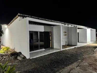 a white house at night with the lights on at RCB guesthouse in Burgersfort