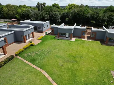 an aerial view of a yard with a bunch of buildings at Mafini Villa in Centurion