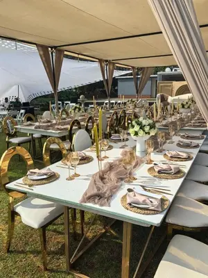 a long table with plates and wine glasses on it at Mafini Villa in Centurion