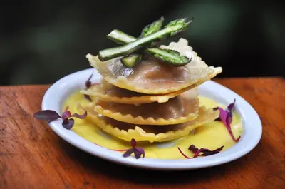 a stack of pancakes on a plate on a table at Timamoon Lodge in Hazyview