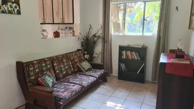 a living room with a couch and a window at Northwich Game Ranch in Louis Trichardt