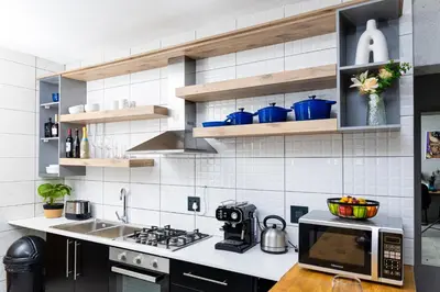 a kitchen with a sink and a microwave at Mills Pad with 2-bedroom in Nelspruit