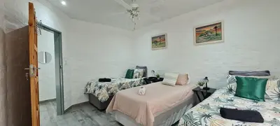 a bedroom with two beds and a window at Tenuta Overnight in Polokwane