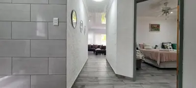 a hallway leading to a living room with a bed at Tenuta Overnight in Polokwane