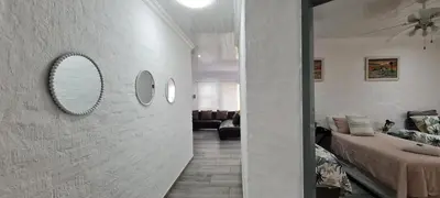 a living room with two mirrors on the wall at Tenuta Overnight in Polokwane