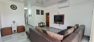 a living room with a couch and a flat screen tv at Tenuta Overnight in Polokwane