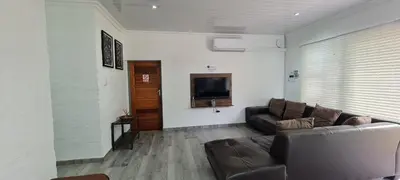 a living room with a couch and a flat screen tv at Tenuta Overnight in Polokwane