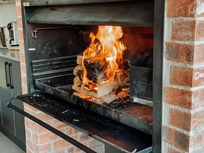 a fire in a brick oven at The Big Easy Rest at Highland Gate Golf & Trout in Dullstroom
