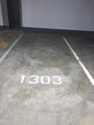 a parking lot with the number on the floor at Alimama Spaces: Koketso's Menlyn Maine in Pretoria