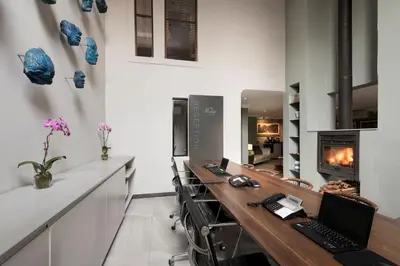 a home office with a desk with a laptop on it at Menlyn Boutique Hotel in Pretoria