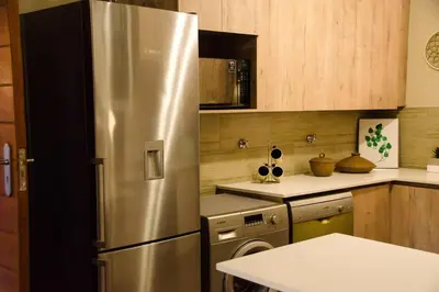a kitchen with a stainless steel refrigerator at Serene Luxury retreat in Cullinan in Cullinan