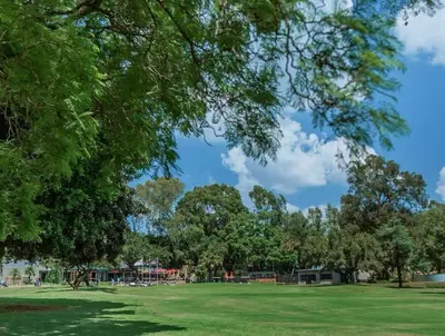 a park with trees and a green field at Serene Luxury retreat in Cullinan in Cullinan
