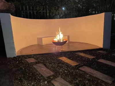 a fire pit with a fire in it at TWO Prefab Living - Luxury bungalows in Dullstroom