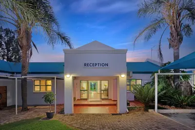 a white building with the registration sign on it at Protea Hotel by Marriott Polokwane Landmark in Polokwane