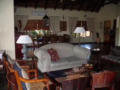 a living room with a couch and a table at Khandizwe Kruger Villa in Malelane