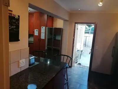 a kitchen with a counter top and a refrigerator at Inviting 3-Bed House in Kempton Park in Kempton Park