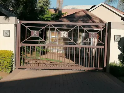 a gate to a house with the number on it at Inviting 3-Bed House in Kempton Park in Kempton Park
