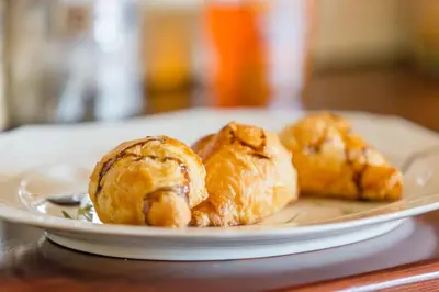 a plate of pastries sitting on a table at Tzaneen Arborpark Lodge in Tzaneen