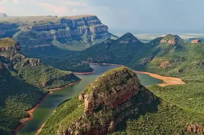 a view of a mountain with a lake in the middle at Amaroks self catering units in Sabie