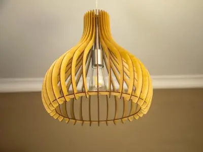 a yellow light fixture hanging from a ceiling at Wilson Guest House in Groblersdal