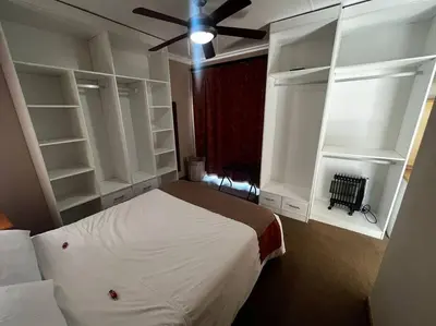 a bedroom with a bed and a ceiling fan at 3-Bedroom House, Greenway Woods, White River in White River