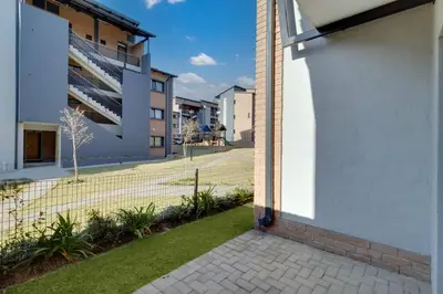 a courtyard of a building with a tennis court at Resting nest waterfall in Midrand