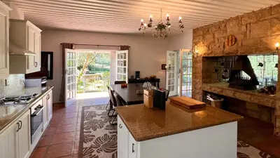 a kitchen with a counter top in a room at Elm Tree House - Dullstroom - holiday home in Dullstroom