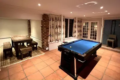 a large room with a pool table and a table at Elm Tree House - Dullstroom - holiday home in Dullstroom