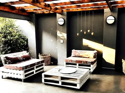 a patio with two couches and a table and chairs at 46 on Allcock Guest Apartment & Luxury Room in Pretoria