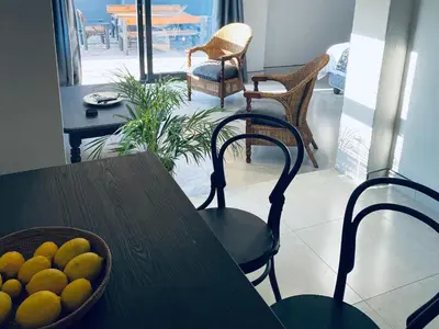 a wooden table with a bowl of fruit on it at 46 on Allcock Guest Apartment & Luxury Room in Pretoria