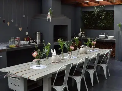 a long table with white rabbits on it in a kitchen at 46 on Allcock Guest Apartment & Luxury Room in Pretoria