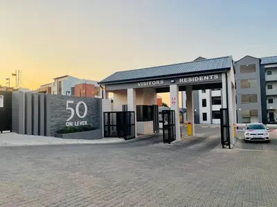 a car is parked in front of a building at Mikeys Place on Lever with Fibre Uncapped WiFi in Midrand