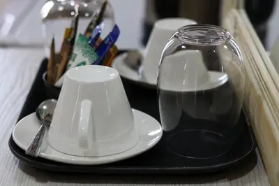 a tray with two cups and a glass on it at Bela Valley Guest House in Bela-Bela