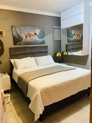 a bedroom with a large bed in a room at Luxuries Penthouse in Nelspruit