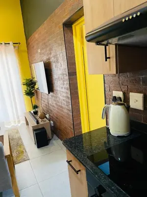 a kitchen with a tea kettle on a counter at Luxuries Penthouse in Nelspruit